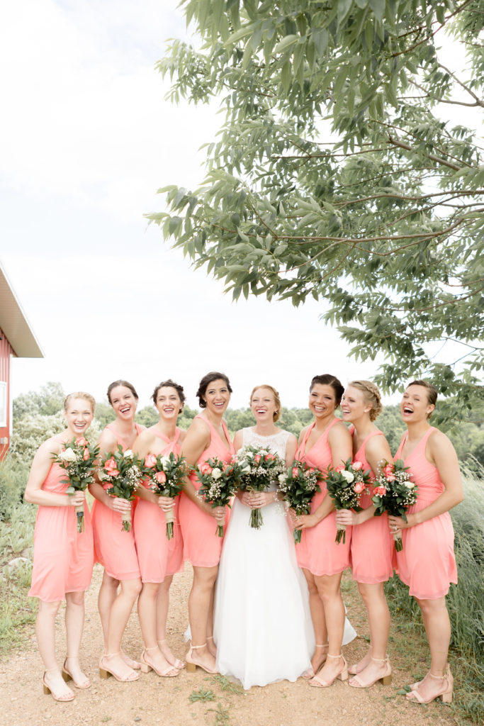 Bride with her Bridesmaids together at the Outpost Center in Chaska
