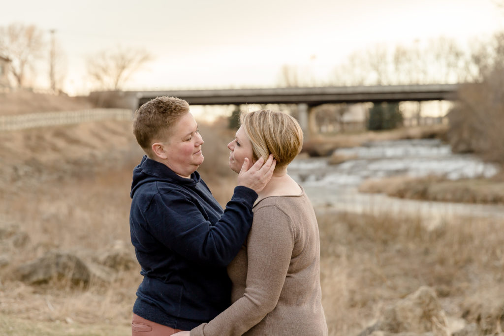 a couple looks into each other's eyes during engagement session